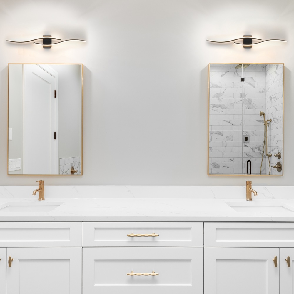 A bathroom vanity light fitting above a mirror
